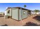 Side view of mobile home showing exterior details at 747 E Germann Rd # 81, San Tan Valley, AZ 85140