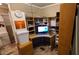 Home office with computer, desk, and shelving at 8120 E Boise St, Mesa, AZ 85207