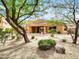 Spacious backyard with desert landscaping and trees at 8494 E Gilded Perch Dr, Scottsdale, AZ 85255