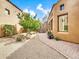 Landscaped backyard with a brick pathway at 8494 E Gilded Perch Dr, Scottsdale, AZ 85255