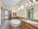 Spa-like bathroom with double sinks, soaking tub, and walk-in shower at 8494 E Gilded Perch Dr, Scottsdale, AZ 85255