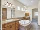 Elegant bathroom with double sinks, soaking tub and separate shower at 8494 E Gilded Perch Dr, Scottsdale, AZ 85255