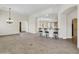 Open concept dining room with breakfast bar and tile floors at 8494 E Gilded Perch Dr, Scottsdale, AZ 85255