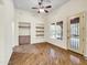 Hardwood floor Gathering room with built-in shelving and backyard access at 8494 E Gilded Perch Dr, Scottsdale, AZ 85255