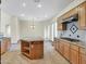 Island kitchen with granite countertops and stainless steel appliances at 8494 E Gilded Perch Dr, Scottsdale, AZ 85255