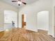 Bright living room featuring hardwood floors and views into adjacent rooms at 8494 E Gilded Perch Dr, Scottsdale, AZ 85255