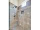 Walk-in shower with tiled walls and a built-in niche at 8494 E Gilded Perch Dr, Scottsdale, AZ 85255