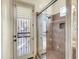 Tiled walk-in shower with glass enclosure and access to backyard at 8494 E Gilded Perch Dr, Scottsdale, AZ 85255