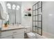 Clean bathroom with white vanity, bathtub, and glass shower enclosure at 8608 E Palo Verde Dr, Scottsdale, AZ 85250