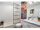 Modern bathroom with white subway tile, marble vanity, and glass shower at 8608 E Palo Verde Dr, Scottsdale, AZ 85250