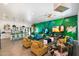 Bright living room with a tropical mural and stylish furniture at 8608 E Palo Verde Dr, Scottsdale, AZ 85250