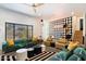 Chic living room with green sofas and a statement wall at 8608 E Palo Verde Dr, Scottsdale, AZ 85250