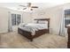 Bright main bedroom featuring a comfortable bed and ample space at 8709 W Hammond Ln, Tolleson, AZ 85353