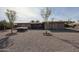 Home's backyard features a hot tub and gravel landscaping at 9215 W Raintree Dr, Sun City, AZ 85351