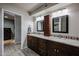 Double vanity bathroom with granite countertops and shower at 9215 W Raintree Dr, Sun City, AZ 85351