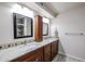 Double vanity bathroom with granite countertops at 9215 W Raintree Dr, Sun City, AZ 85351