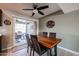 Bright dining room with wood table and access to the backyard patio at 9215 W Raintree Dr, Sun City, AZ 85351