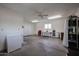 Large workshop area in garage with storage cabinets and mini-fridge at 9215 W Raintree Dr, Sun City, AZ 85351