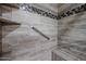 Walk-in shower with tiled walls and built-in seat at 9215 W Raintree Dr, Sun City, AZ 85351