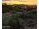 Stunning sunset view of the mountain landscape and homes at 9253 N Firebrick Dr # 212, Fountain Hills, AZ 85268