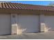 Attached two-car garage with light beige doors at 9253 N Firebrick Dr # 212, Fountain Hills, AZ 85268