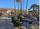 Community hot tub and waterfall feature with lush landscaping at 9253 N Firebrick Dr # 212, Fountain Hills, AZ 85268