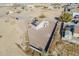 Aerial view of house with gravel backyard and solar panels at 9321 W Hillcrest Pl, Arizona City, AZ 85123