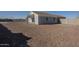 Large backyard with gravel and block wall at 9321 W Hillcrest Pl, Arizona City, AZ 85123