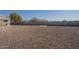 Spacious backyard with gravel and block wall at 9321 W Hillcrest Pl, Arizona City, AZ 85123