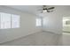 Bright bedroom with light flooring and a double door closet at 9321 W Hillcrest Pl, Arizona City, AZ 85123