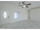 Living room with tile floors and a ceiling fan at 9321 W Hillcrest Pl, Arizona City, AZ 85123