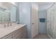 Clean bathroom with a vanity, a large mirror, and a shower at 9336 E Obispo Ave, Mesa, AZ 85212