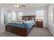 Spacious bedroom with a large bed, nightstand, and plenty of natural light at 9336 E Obispo Ave, Mesa, AZ 85212