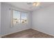 Well lit bedroom with wood flooring and a large window at 9336 E Obispo Ave, Mesa, AZ 85212