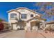 Two story home with attached garage and well maintained landscaping at 9336 E Obispo Ave, Mesa, AZ 85212