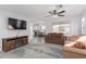 Spacious living room featuring a fireplace and ample natural light at 9336 E Obispo Ave, Mesa, AZ 85212