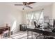 Bright home office featuring a desk, chair, and built-in shelving at 9336 E Obispo Ave, Mesa, AZ 85212