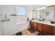 Double vanity bathroom with wood cabinets and a large mirror at 109 E Milada Dr, Phoenix, AZ 85042