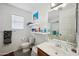 Clean bathroom with a shower, toilet and floating shelves at 109 E Milada Dr, Phoenix, AZ 85042