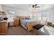 Large bedroom with a wooden bed frame and ample natural light at 109 E Milada Dr, Phoenix, AZ 85042