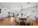 Bright dining room with a large table and hardwood floors at 109 E Milada Dr, Phoenix, AZ 85042
