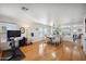 Open concept dining room with hardwood floors and view to living room at 109 E Milada Dr, Phoenix, AZ 85042