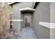 Front door entrance with a security door and brick walkway at 109 E Milada Dr, Phoenix, AZ 85042