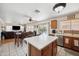 Kitchen with island, views into living area and backyard at 109 E Milada Dr, Phoenix, AZ 85042