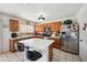 Open kitchen with large island and stainless steel appliances at 109 E Milada Dr, Phoenix, AZ 85042