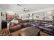 Spacious living room with sectional sofa, kitchen view and hardwood floors at 109 E Milada Dr, Phoenix, AZ 85042