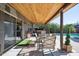 Covered patio with seating area and hot tub, overlooking pool at 109 E Milada Dr, Phoenix, AZ 85042
