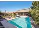 Inviting swimming pool, surrounded by lush landscaping at 109 E Milada Dr, Phoenix, AZ 85042