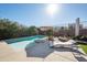 Relaxing pool area with lounge chairs and patio umbrella at 109 E Milada Dr, Phoenix, AZ 85042