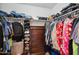 Walk-in closet with double hanging rods and drawers at 109 E Milada Dr, Phoenix, AZ 85042